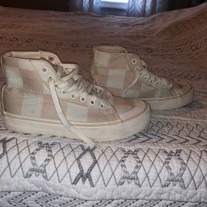 woman’s pink checkered vans